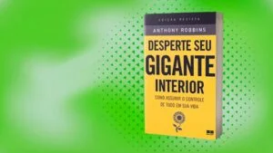 Livro 'Desperte Seu Gigante Interior' de Anthony Robbins, com capa amarela e preta, em um fundo verde texturizado